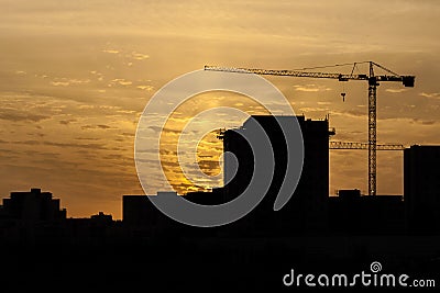 Silhouette of a tower crane Stock Photo