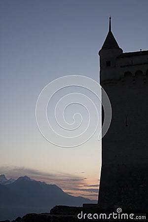 Silhouette of the tower in the sunset. Chillon castle in Montreux city on Geneva lake in Switzerland Editorial Stock Photo