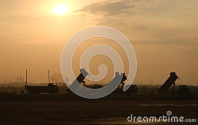 Silhouette Truck at construction site Stock Photo