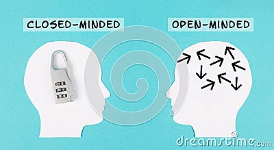 Silhouette of two people, one man is closed minded with a lock in his head, opposite to the person with the open minded brain Stock Photo