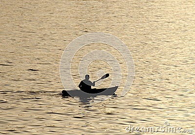 Silhouette of undefined kayaer on water at beautiful sunset time. Santa Cruz Editorial Stock Photo