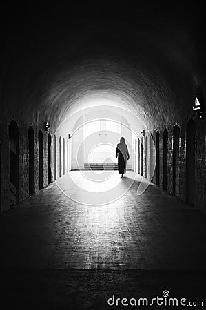 Silhouette of unrecognizable woman in medieval room Stock Photo