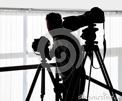 Silhouette of video and photographic equipment Stock Photo