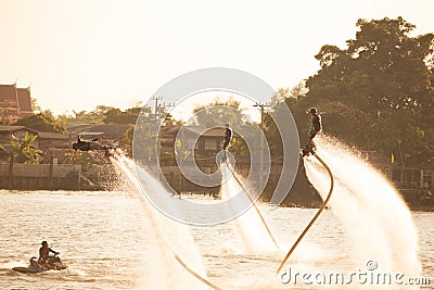 Silhouette and vintage color styl of showing flyboard on Chaophya Editorial Stock Photo