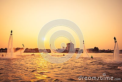 Silhouette and vintage color styl of showing flyboard on Chaophya Editorial Stock Photo