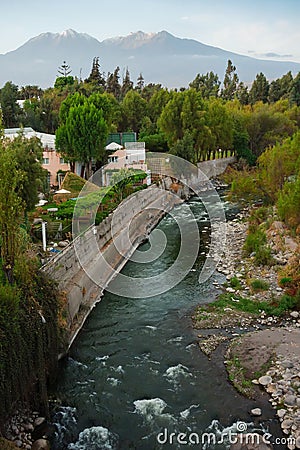 Silhouette of Volcan Chachani and river in Arequipa city Stock Photo