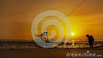 Silhouette of wedding couple with the sunset Stock Photo