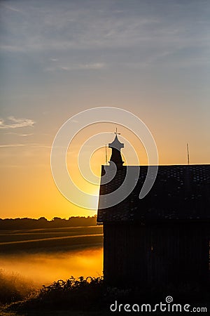 Silhouette of a Wisconsin barn in an early September morning Stock Photo