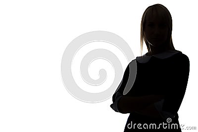 Silhouette of woman with arms crossed, half-turned Stock Photo