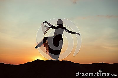 Silhouette of a woman in the desert. Stock Photo