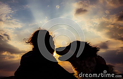 silhouette of woman and dog head at sunset pet teraphy Stock Photo