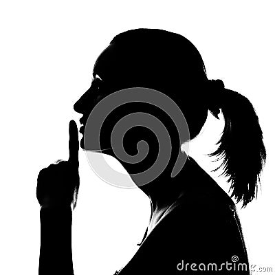 Silhouette of woman with hush sign Stock Photo