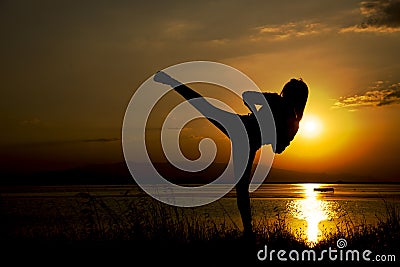 Silhouette woman kick training Stock Photo