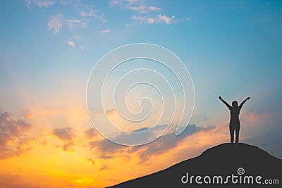 Silhouette of woman on mountain top over sky and sun light background,business, success Stock Photo