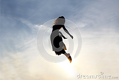 Silhouette of Woman Rising into Heaven Stock Photo