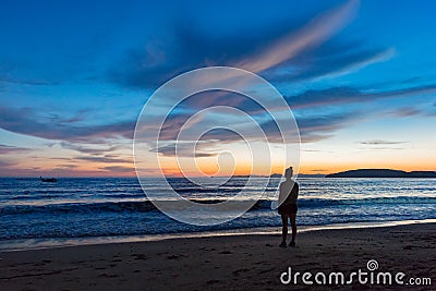 Silhouette Woman Standing At Beach During Sunset Editorial Stock Photo