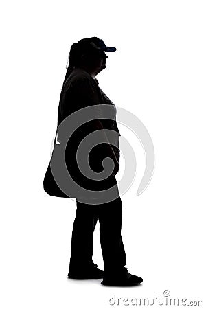 Silhouette of a Woman Standing and Waiting in Line Stock Photo
