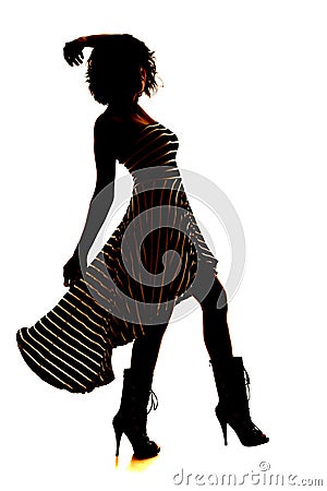 Silhouette woman stripe dress blow leg up Stock Photo