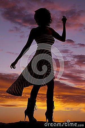 Silhouette woman stripe dress blow look back Stock Photo