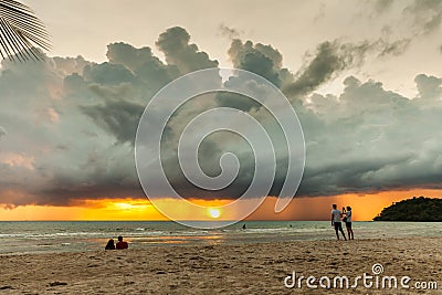 Silhouette woman on the tropical beach on background dramatic storm sky Editorial Stock Photo