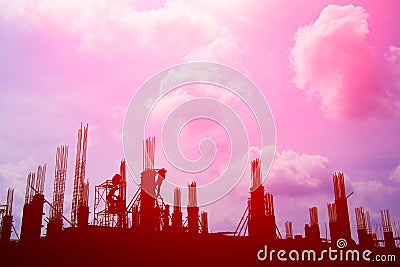 Silhouette worker team working construction site pink sky background with copy space add text Stock Photo