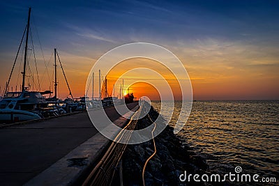 Silhouette of Yacht Parking Pier in the Sunset Stock Photo