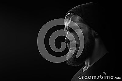 Silhouette of young bearded man hipster Stock Photo