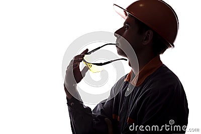 Silhouette of a young constructer thinking of a career, a man in a helmet on a white isolated background Stock Photo