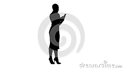 Silhouette Young focused female looking in her phone. Stock Photo