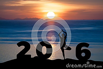 Silhouette young woman play Yoga on the sea and 2016 years while celebrating new year Stock Photo