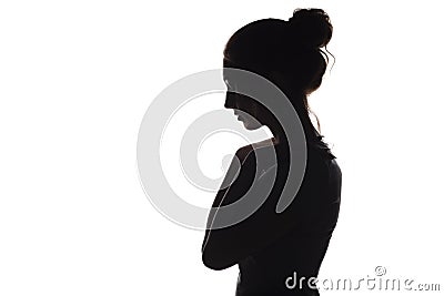 Silhouette of a young woman on a white isolated background, face profile of a beautiful girl Stock Photo