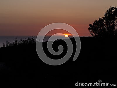 Silhouetted sunset Stock Photo