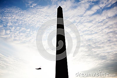 Silhouetted Washington Monument and Marine One Helicopter Stock Photo