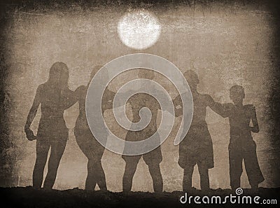 Silhouettes of boys and girls hugging on the beach on sunny summer day Stock Photo