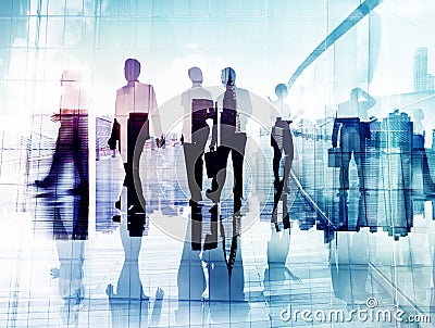 Silhouettes of Business People in Blurred Motion Walking Stock Photo