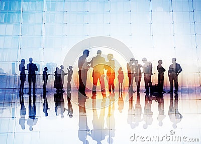 Silhouettes of Business People Discussing Outdoors Stock Photo