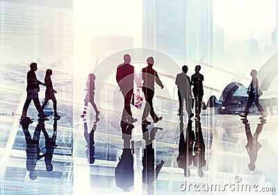 Silhouettes of Business People Walking inside the Office Stock Photo