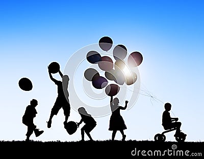 Silhouettes of Children Playing Balloons and Riding Bicycle Stock Photo