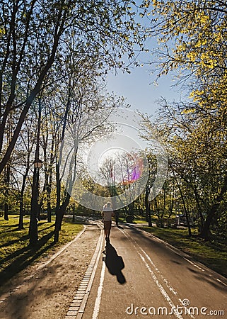 silhouettes father carry child at sunset in summer. Happy family spending time together outside in nature Stock Photo