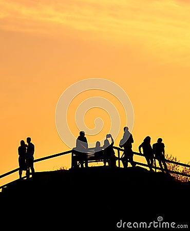 Silhouettes group people sunset park Editorial Stock Photo