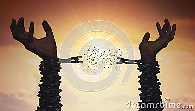 Silhouettes of hands are breaking chain. Freedom concept. Stock Photo
