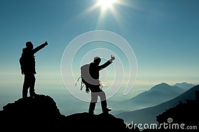 Hikers on mountain top Stock Photo