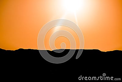 Silhouettes of mountains on the background of sunset, solar eclipse Stock Photo