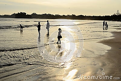 People enjoying sunset on the beach Editorial Stock Photo