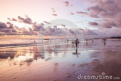 Silhouettes of a people and surfers at the beach. Editorial Stock Photo