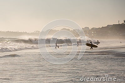 Silhouettes of a people and surfers at the beach. Editorial Stock Photo