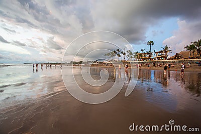 Silhouettes of a people and surfers at the beach. Editorial Stock Photo