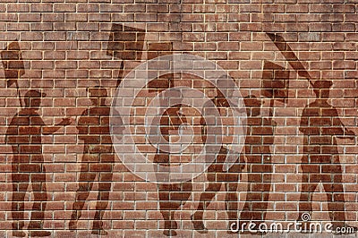 Silhouettes of protesting people against the the flag of Barcelona on the break wall background Stock Photo