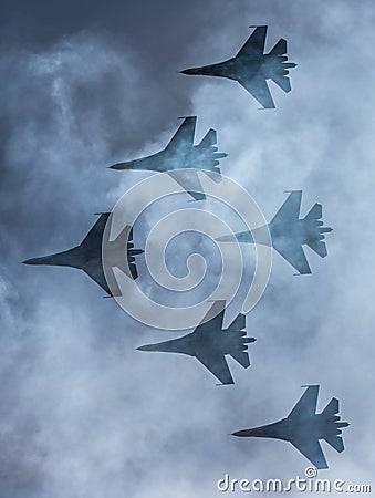 Silhouettes of russian fighter aircrafts SU-27 in the sky Stock Photo