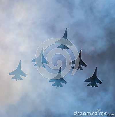 Silhouettes of russian fighter aircrafts SU-27 in the sky Stock Photo